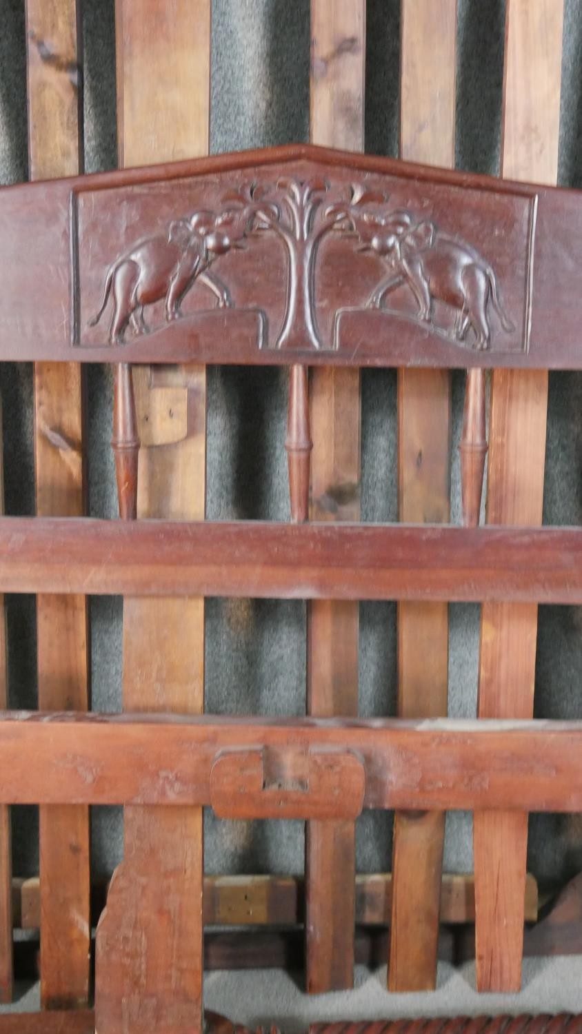 An Indian hardwood double four poster bed, with four wrythen columns, the headboard with a reserve - Image 7 of 7