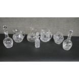 A collection of seven pieces of cut crystal, including a pair of oil and vinegar bottles with