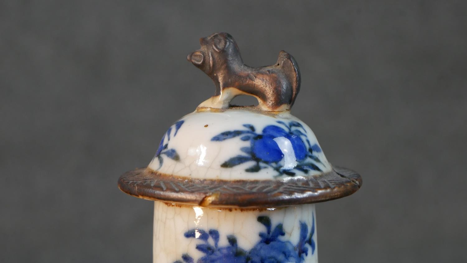 A pair of early 20th century Chinese blue and white crackle glazed vases and covers. The lidded jars - Image 3 of 8