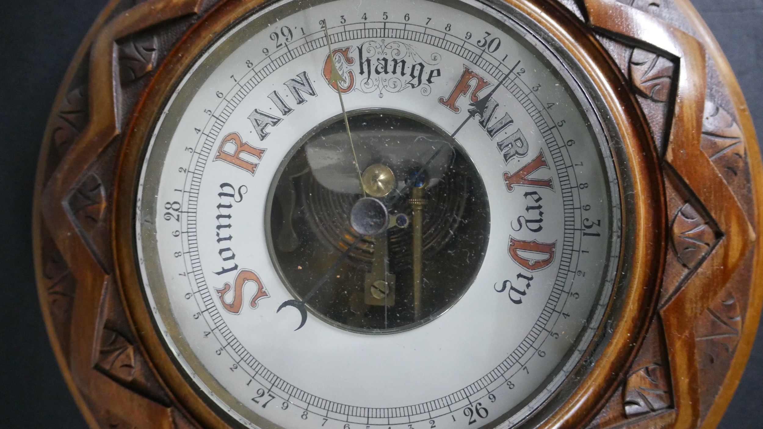 An early 20th century carved oak Barometer with enamel dial along with a marquetry shield - Image 4 of 6