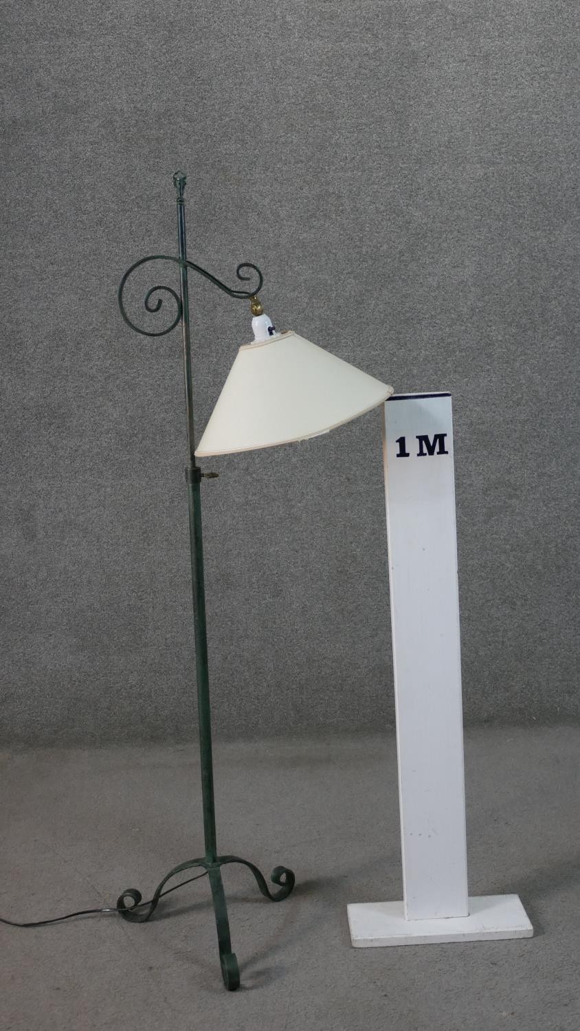 A Victorian style wrought iron standard lamp with a verdigris finish, a cream coloured shade, on - Image 2 of 6