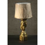 A classical style table lamp, the moulded gilt painted stem in the form of The Three Graces, with