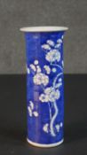 An early 20th century Chinese blue and white hand painted porcelain cylindrical vase with flared