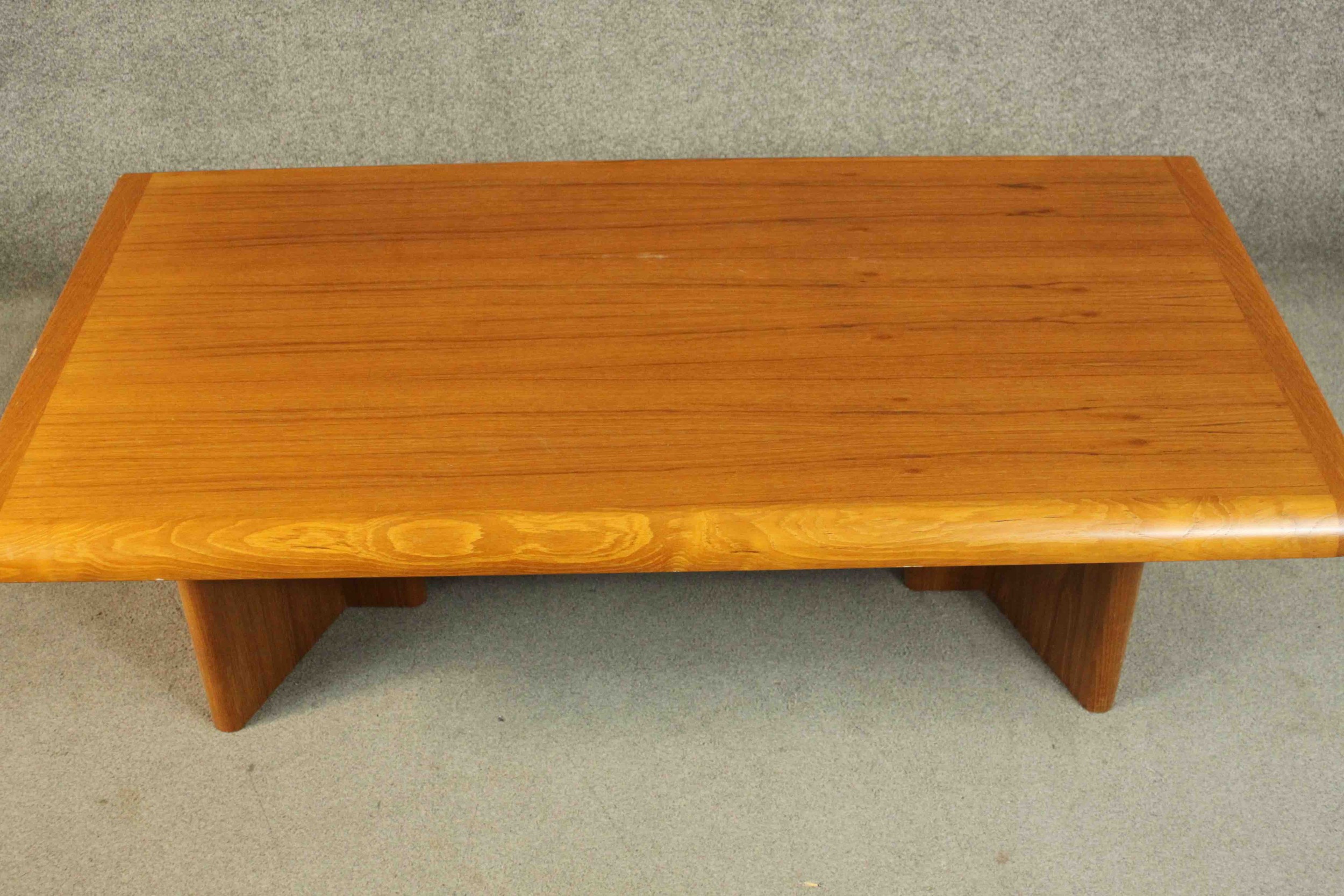 A 1970s vintage Danish teak coffee table on shaped block end supports. H.40 W.135 D.75cm. - Image 3 of 6
