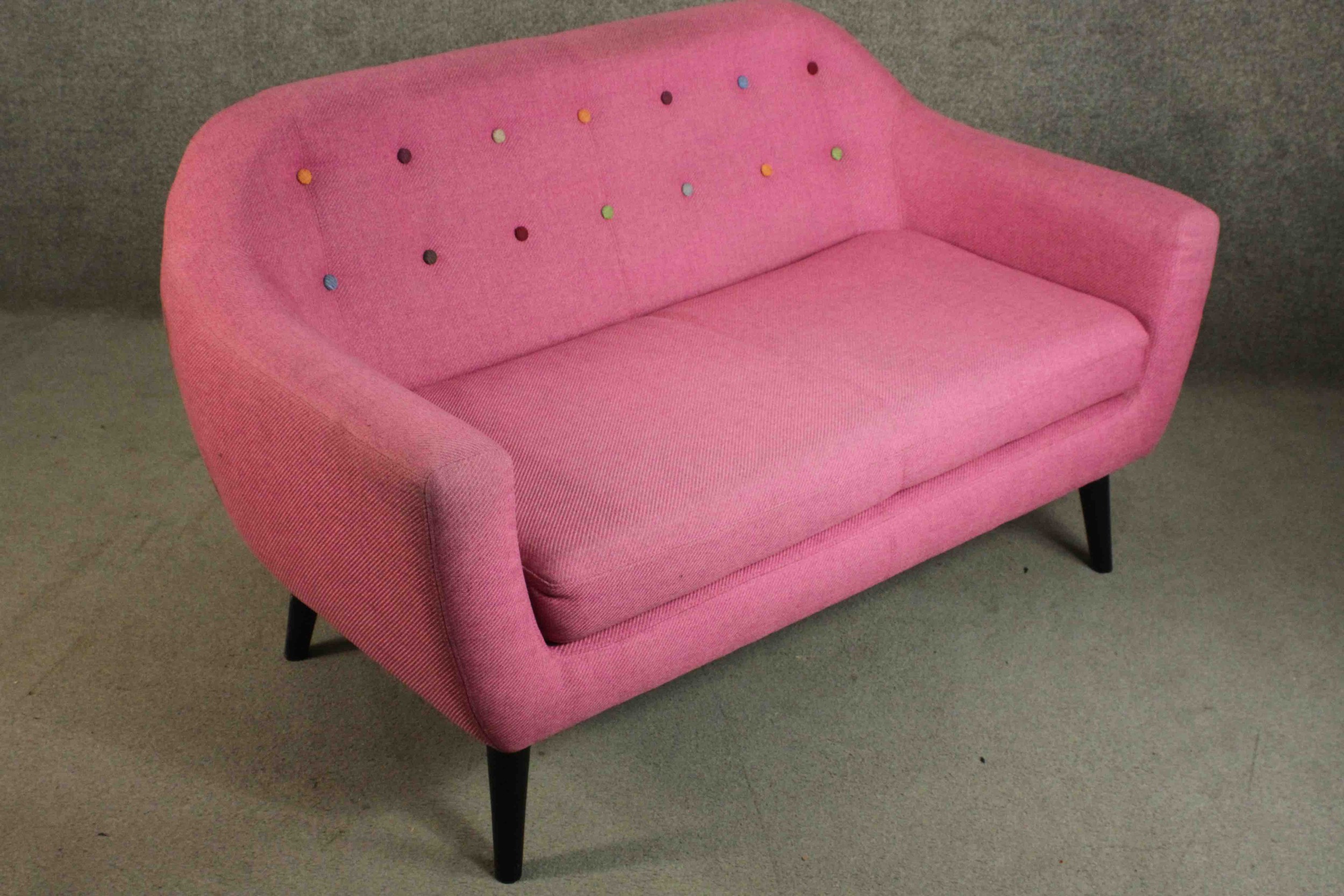 A contemporary Made.com Ritchie sofa, upholstered in pink with a polychrome buttoned back on - Image 6 of 8