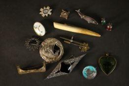 A collection of silver jewellery, including various Danish silver brooches, a taj mahal charm,
