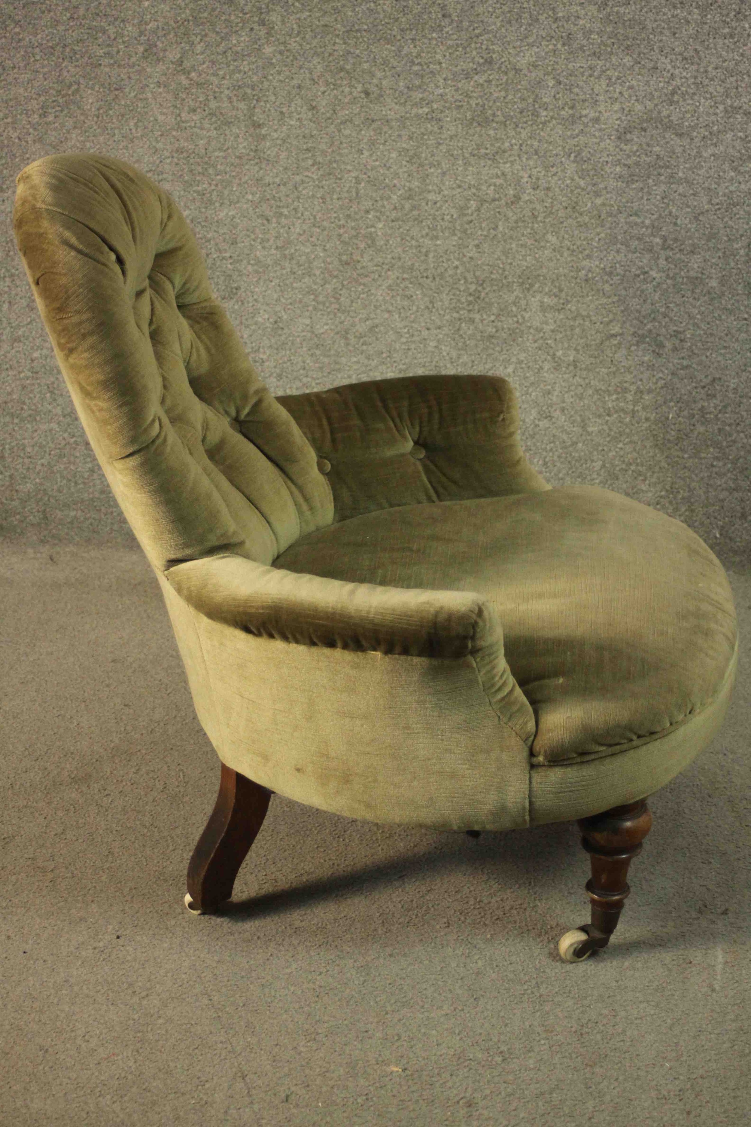 A Victorian armchair, upholstered in green velour with a buttoned back and arms, on turned walnut - Image 5 of 7
