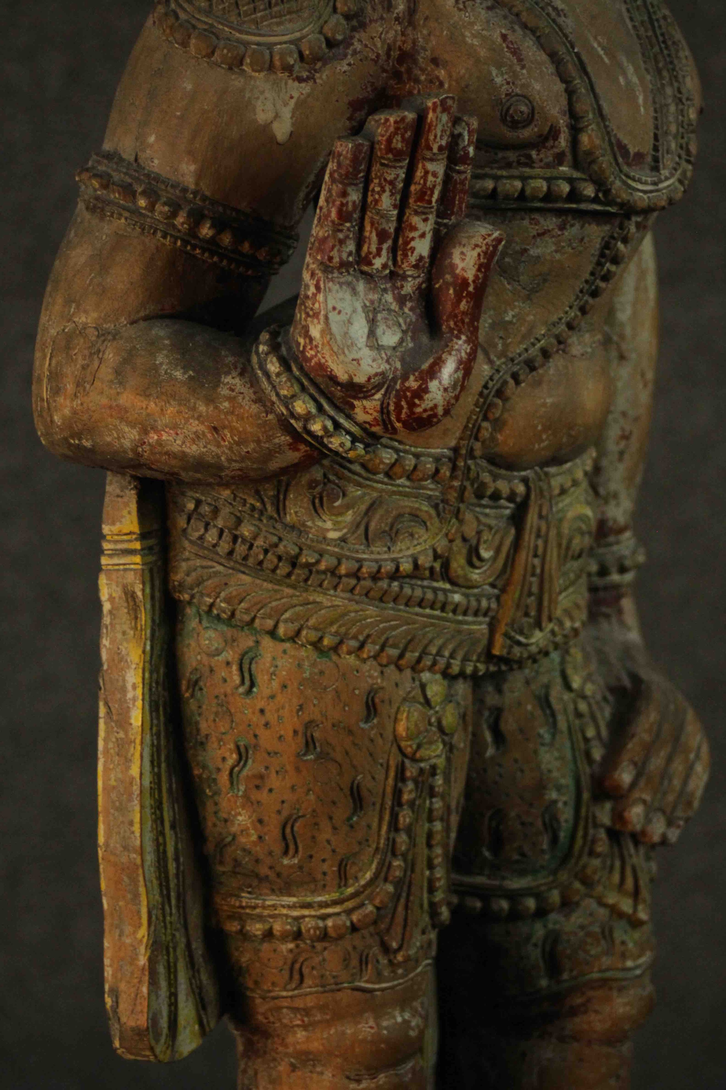 A large carved and painted 19th century Oriental statue of a deity standing on a lotus form base. - Image 7 of 10