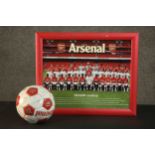 A framed Arsenal F.C. poster from the 2008/9 season along with a football with printed signatures of