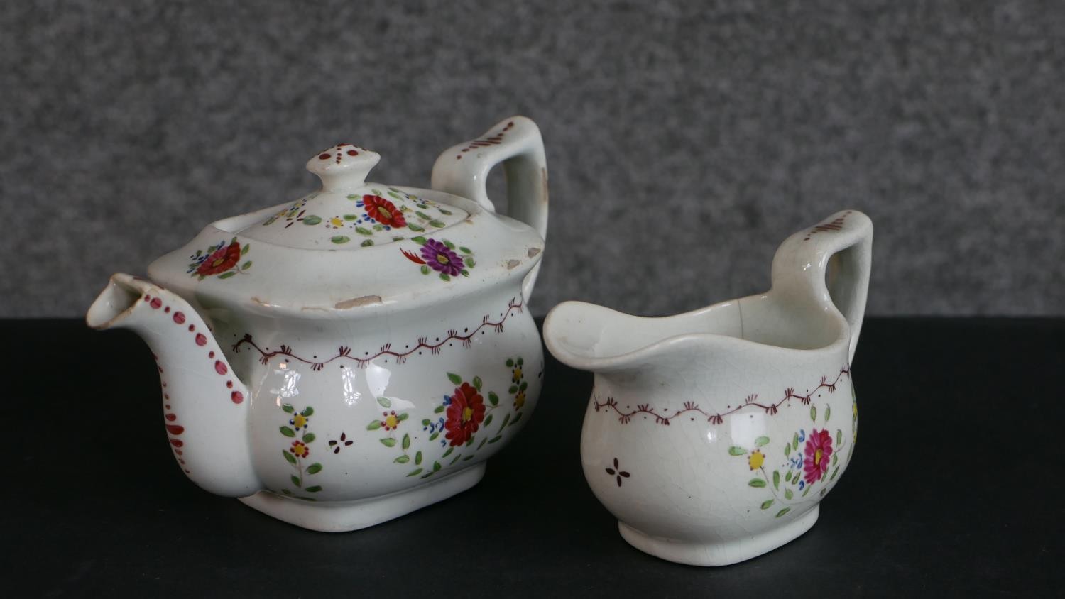 A 19th century floral design hand-painted ceramic dolls tea set for four people (one cup missing), - Image 3 of 8