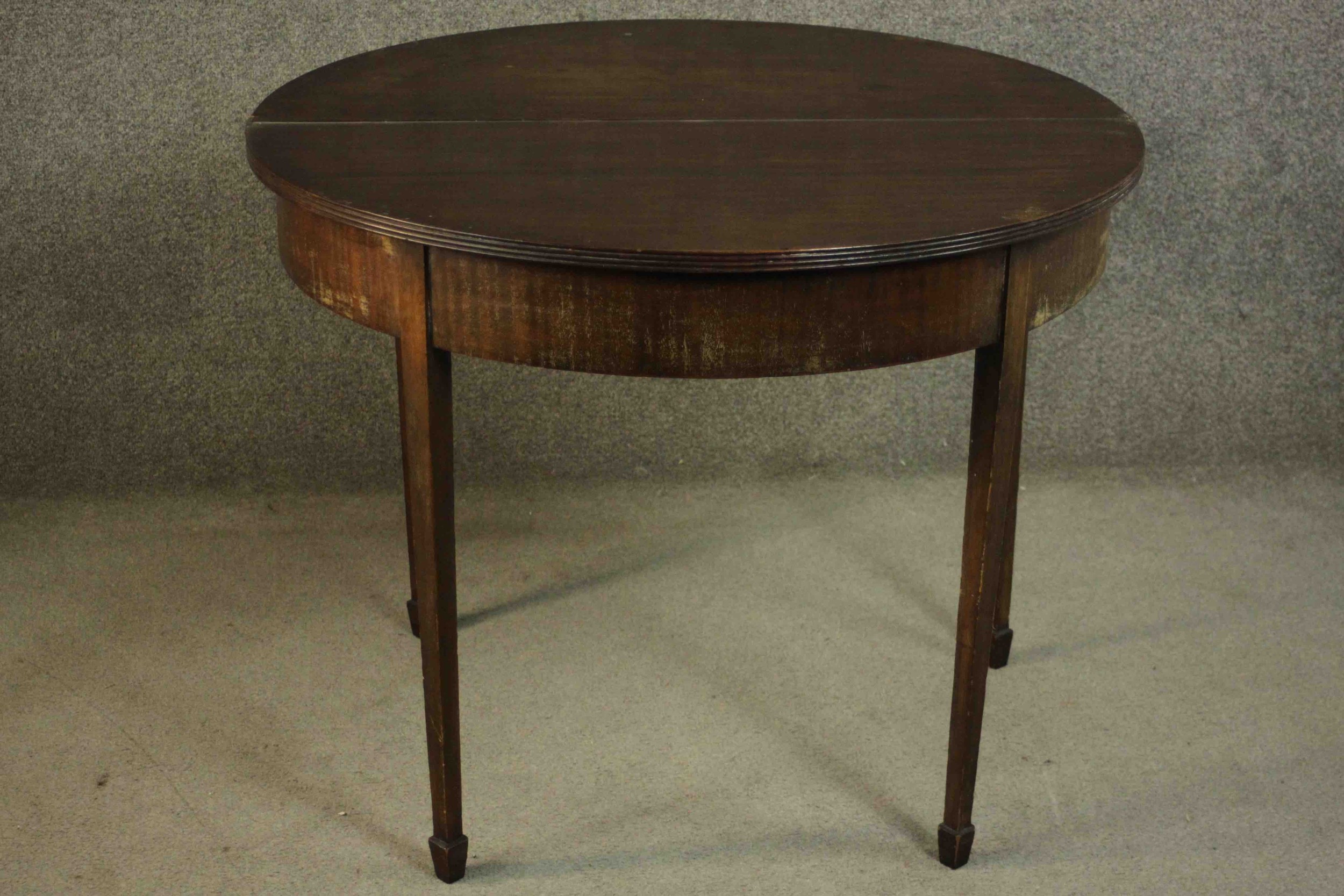 A George III mahogany demi-lune tea table, with a moulded edge and foldover top on square section - Image 3 of 10