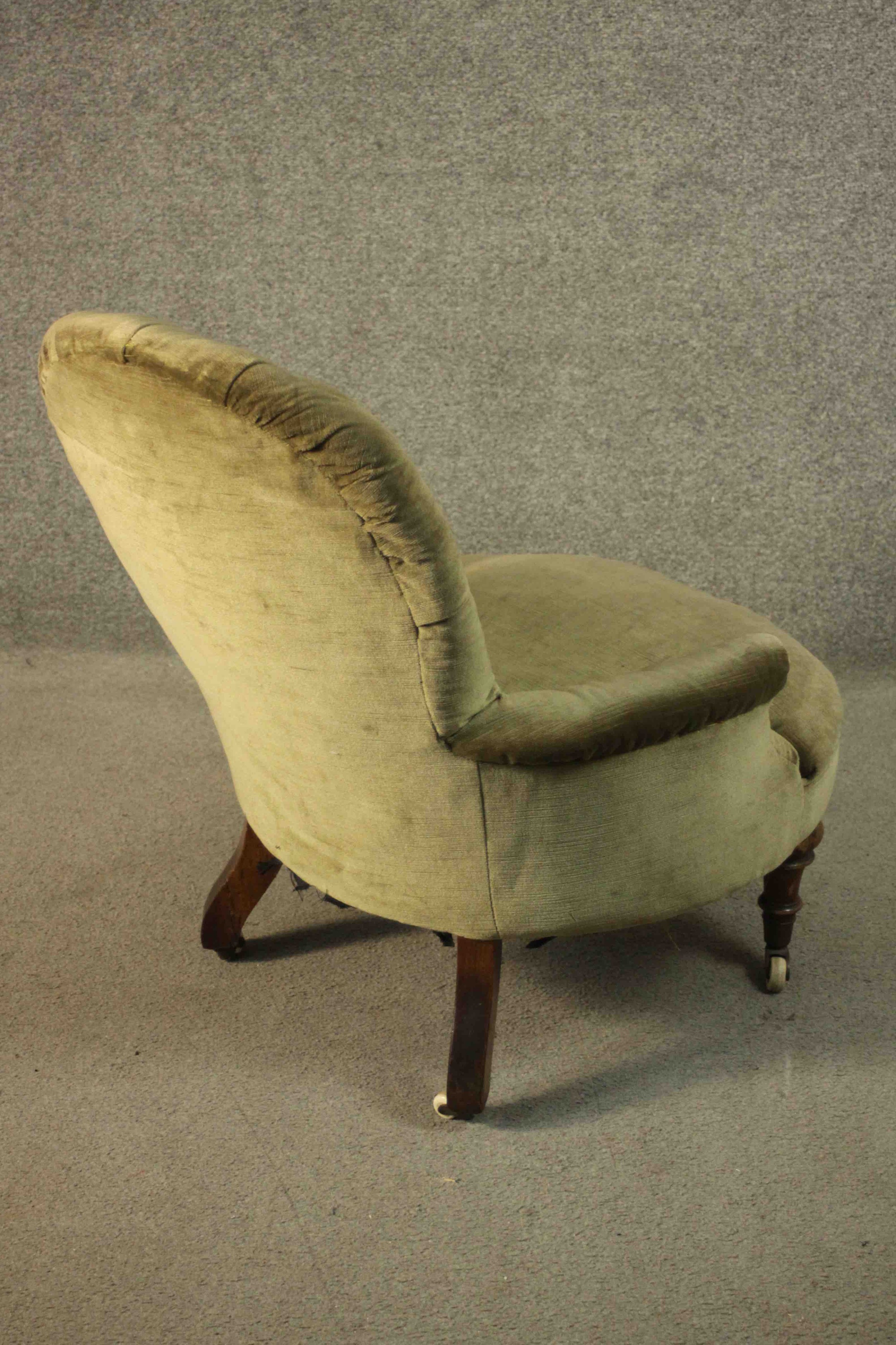 A Victorian armchair, upholstered in green velour with a buttoned back and arms, on turned walnut - Image 6 of 7