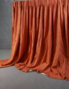 A pair of fully lined orange linen mix diamond pattern curtains. L.230 W.590cm