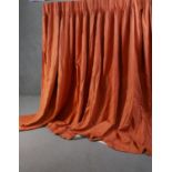 A pair of fully lined orange linen mix diamond pattern curtains. L.230 W.590cm