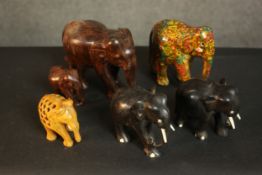 A collection of six carved and painted Indian elephants, including a mother and baby. H.3 W.16 D.