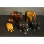 A collection of six carved and painted Indian elephants, including a mother and baby. H.3 W.16 D.