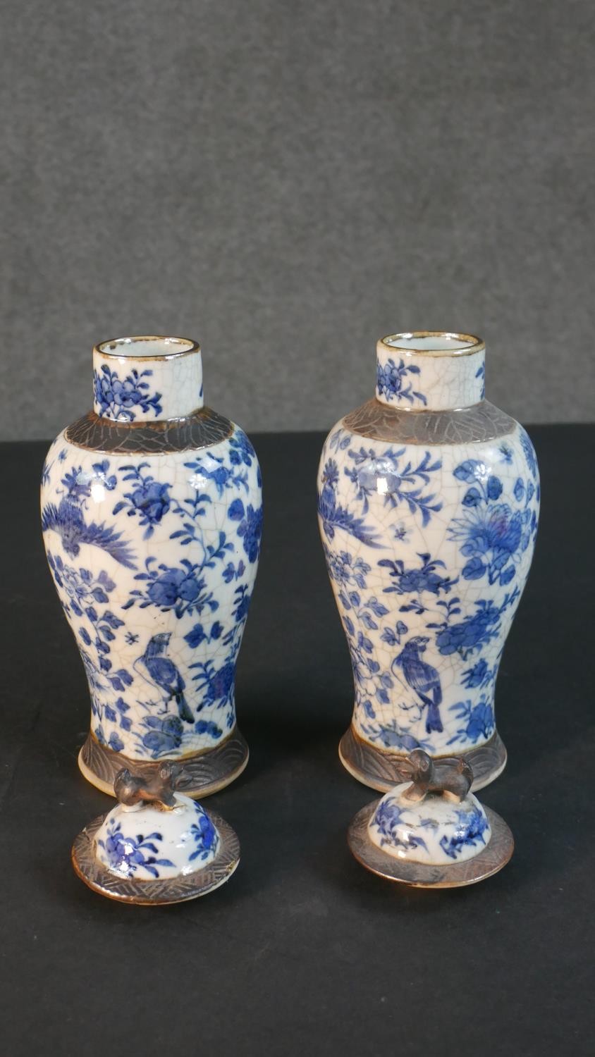 A pair of early 20th century Chinese blue and white crackle glazed vases and covers. The lidded jars - Image 7 of 8