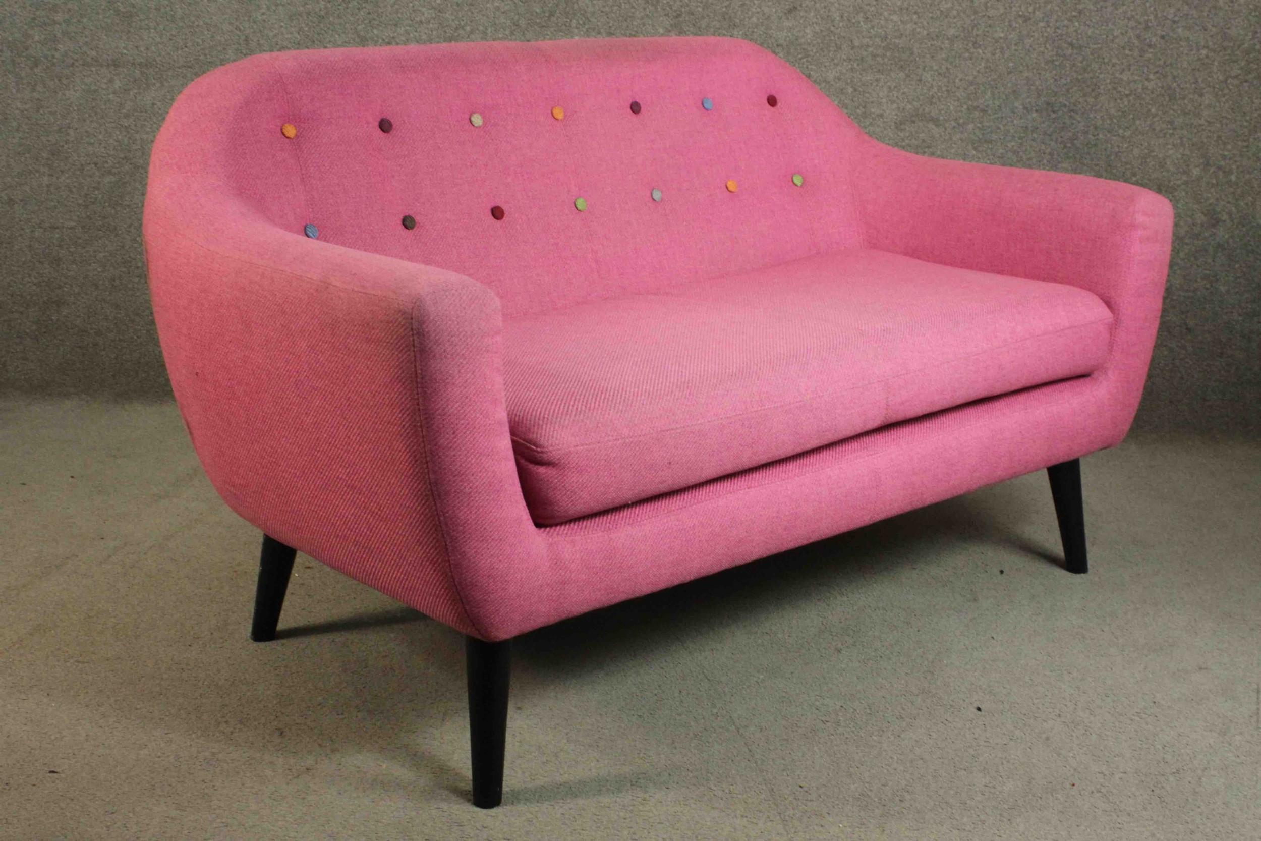 A contemporary Made.com Ritchie sofa, upholstered in pink with a polychrome buttoned back on - Image 7 of 8