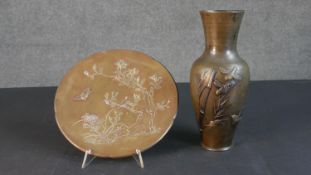 An early 20th century Japanese mixed metal and bronze relief design vase and plate. The vase with