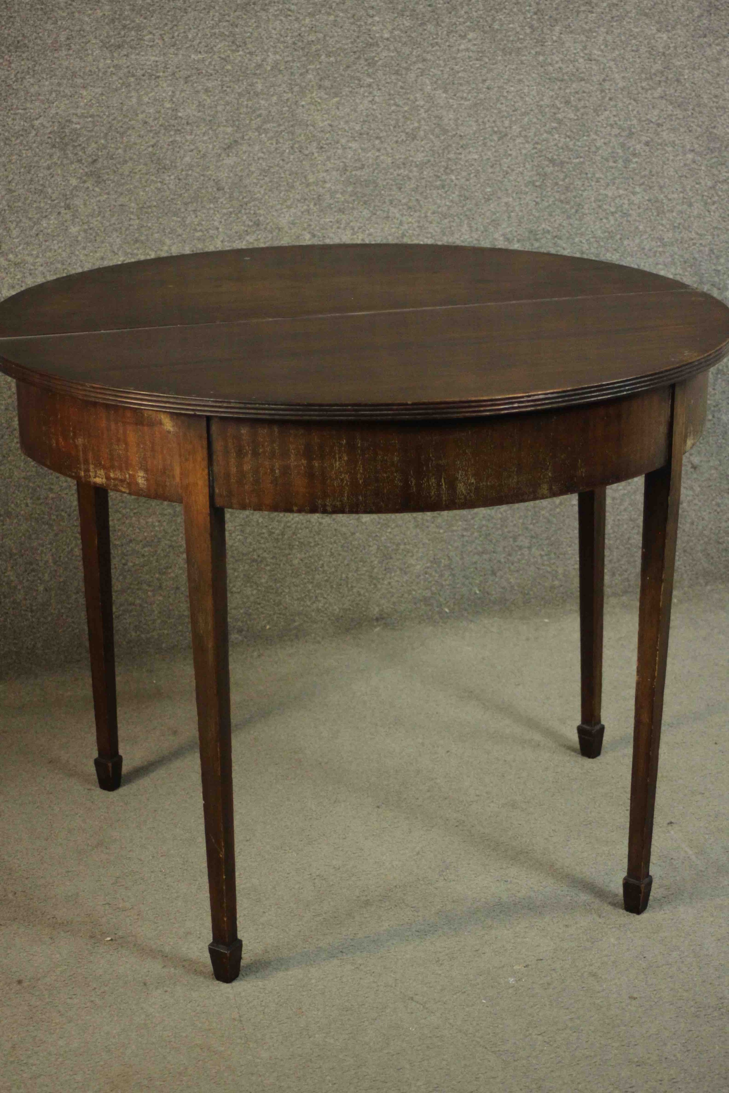 A George III mahogany demi-lune tea table, with a moulded edge and foldover top on square section - Image 5 of 10