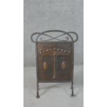 A Victorian Arts & Crafts planished copper fire screen, in a riveted wrought iron frame with