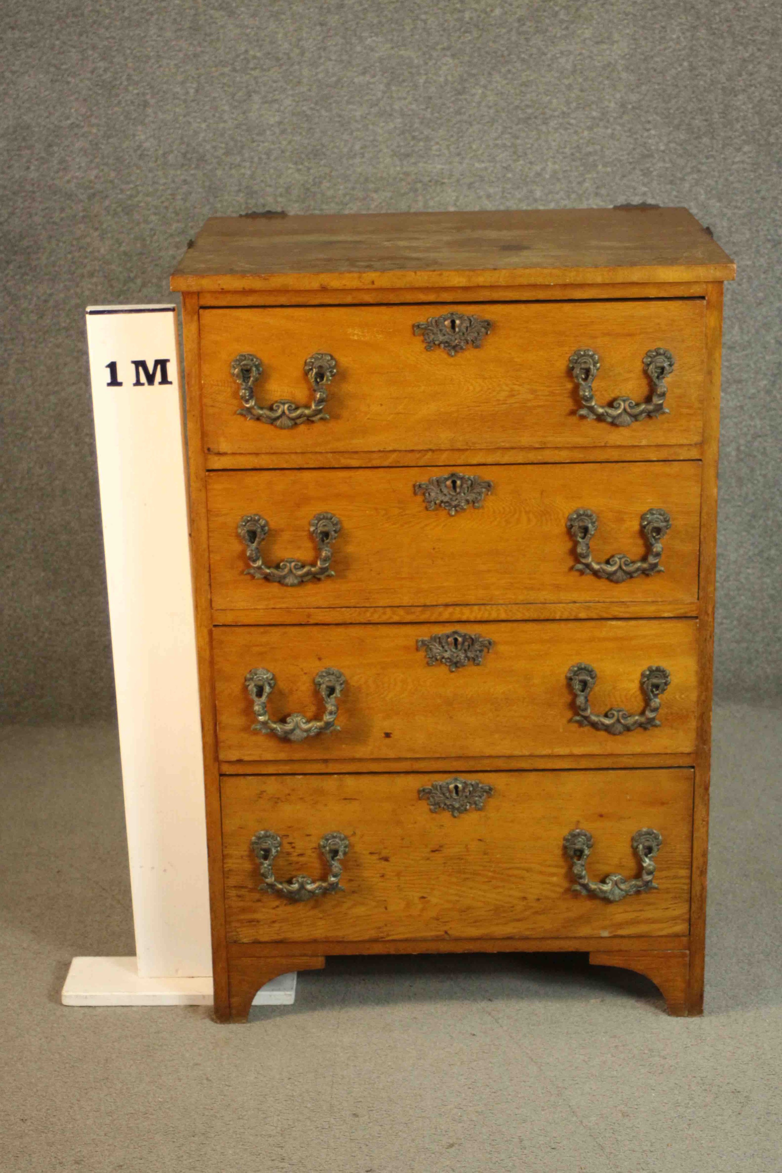 A late 19th/early 20th century oak chest of four long drawers with ornately cast bronze swing - Image 2 of 8