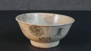 A Qing period Chinese blue and white character design footed bowl. H.9 Diam.19cm