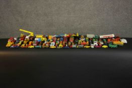 A large collection of approximately eighty play worn die cast vehicles. Various makes including