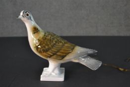 A hand painted porcelain pigeon converted into a novelty table lamp. (no plug) H.21 W.24cm