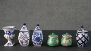 A collection of ceramics, including a blue and white Delft vase, two hand painted sugar bowls one