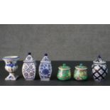 A collection of ceramics, including a blue and white Delft vase, two hand painted sugar bowls one