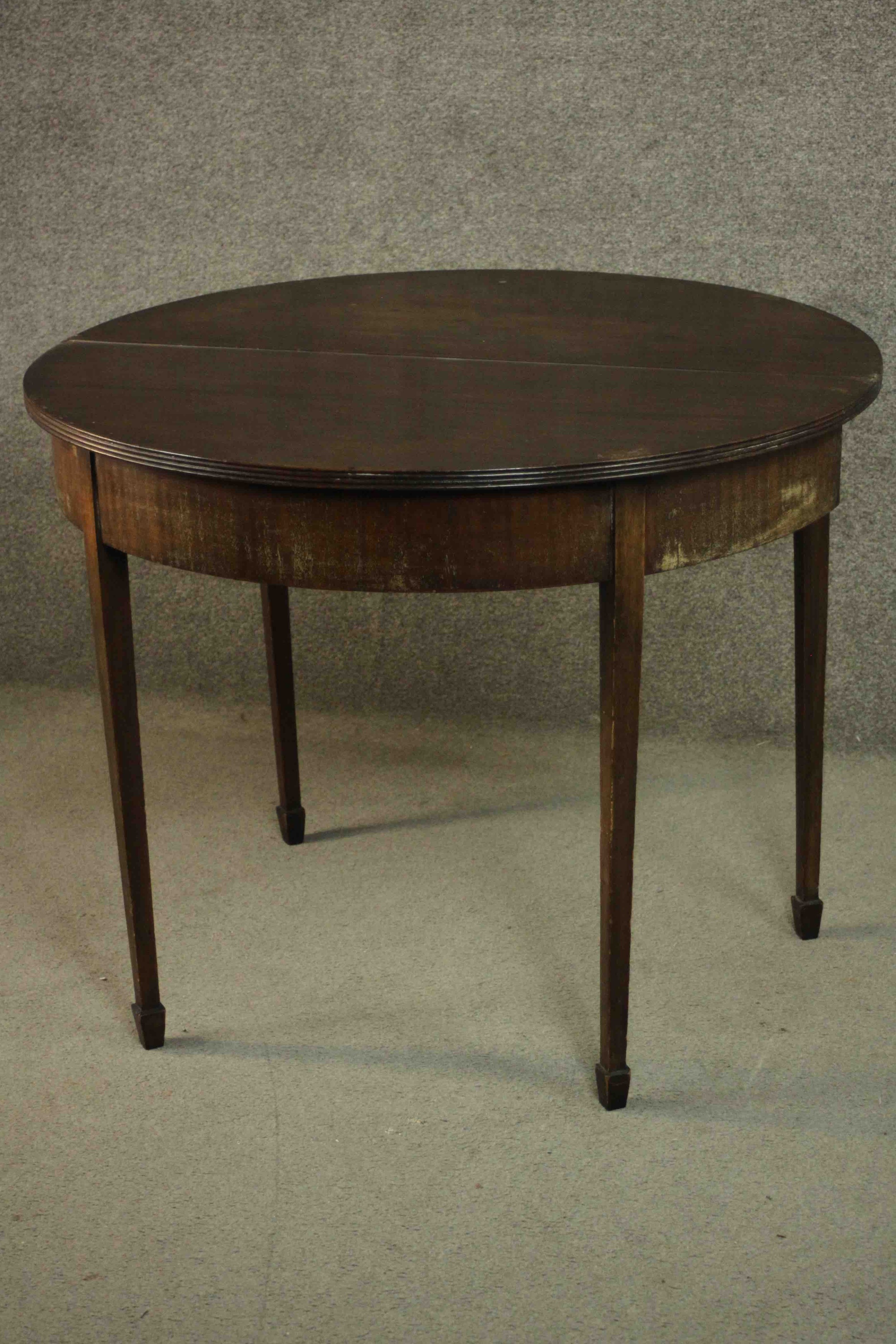 A George III mahogany demi-lune tea table, with a moulded edge and foldover top on square section - Image 4 of 10