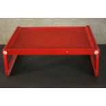 A red acrylic Guzzini folding tray, Jolly, designed by Luigi Massoni, Italy. Makers label to base.