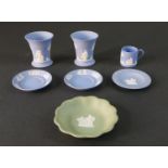 A collection of Wedgwood Jasperware, including two blue and white classical design vases, a coffee