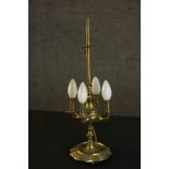 A 19th century brass four branch converted desk lamp on a ridged base. (one foot missing) H.50 Dia.