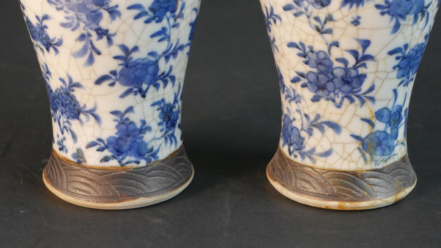 A pair of early 20th century Chinese blue and white crackle glazed vases and covers. The lidded jars - Image 5 of 8