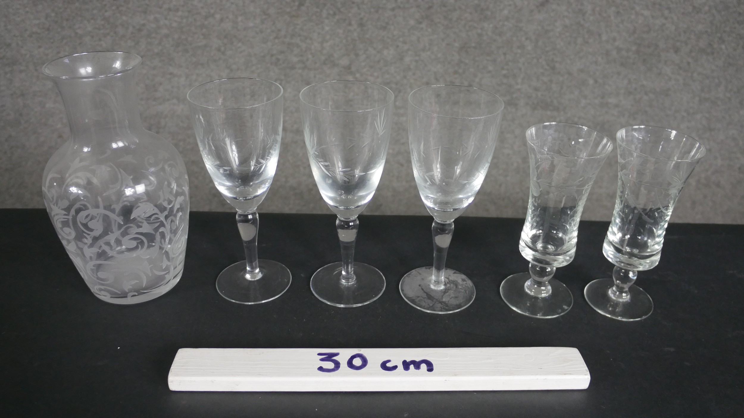 A collection of six pieces of etched glassware, including a stylised foliate design carafe, a set of - Image 2 of 5
