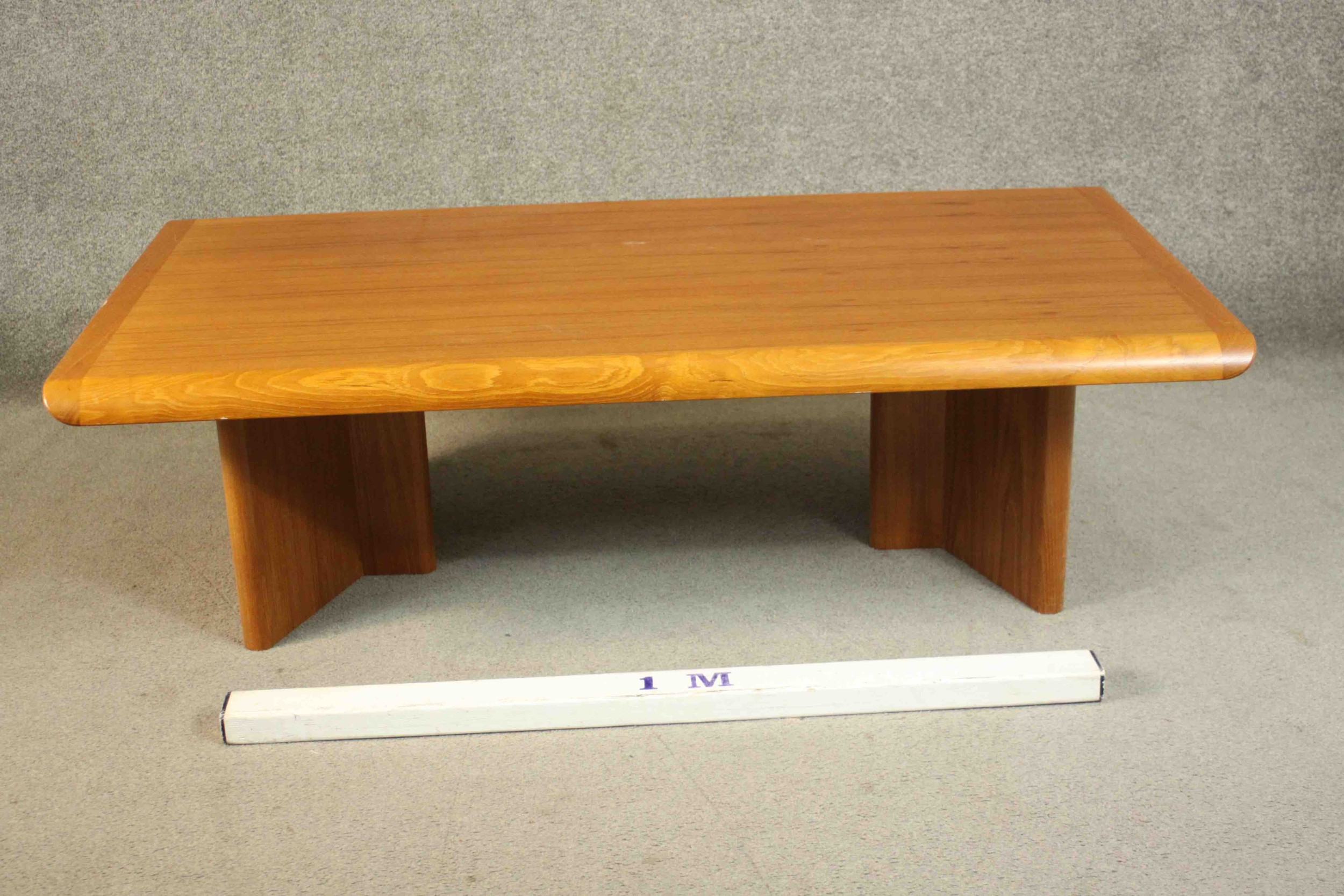 A 1970s vintage Danish teak coffee table on shaped block end supports. H.40 W.135 D.75cm. - Image 2 of 6