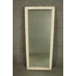 A tall late 19th century pier mirror the moulded frame white painted. H.117 W.49cm.