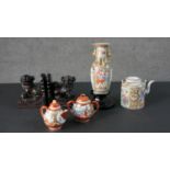 A pair of carved soapstone Foo Dog bookends along with a Japanese hand painted tea pot and sugar