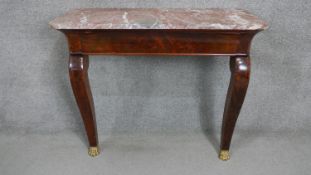 A continental Empire style flame mahogany console table with a marble top on cabriole legs with gilt