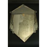 An Art Deco wall mirror the central diamond shaped mirror plate with bevelled edges and Odeon design