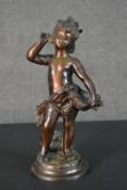 A spelter figure of a classical style putti with a basket of flowers. H.37cm