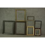 A collection of eight various picture frames, including gilded examples, and a carved wood frame.