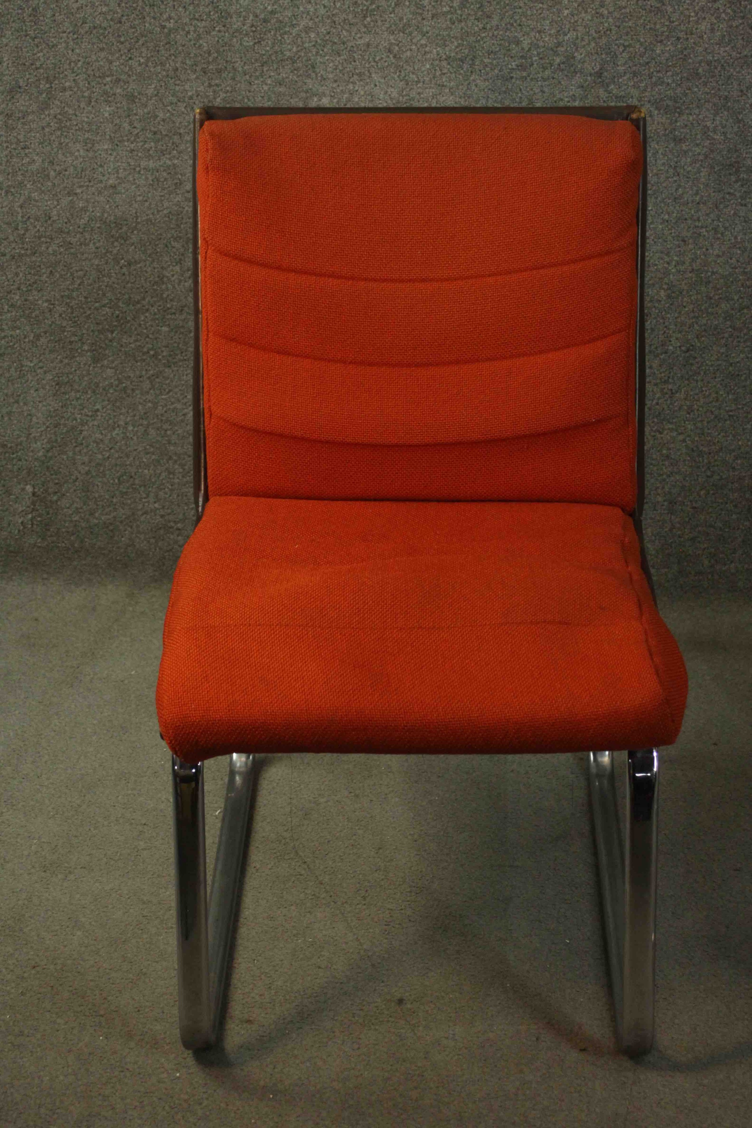 Gordon Russell for Verco, an office chair, upholstered in red fabric, with a leather frame, on