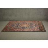 A blue ground fine handmade Persian Keshan rug with a central medallion. L.225 W.130cm.