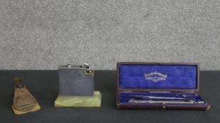 A West and Partners leather cased set of drawing instruments along with a 1843 Royal coat of arms