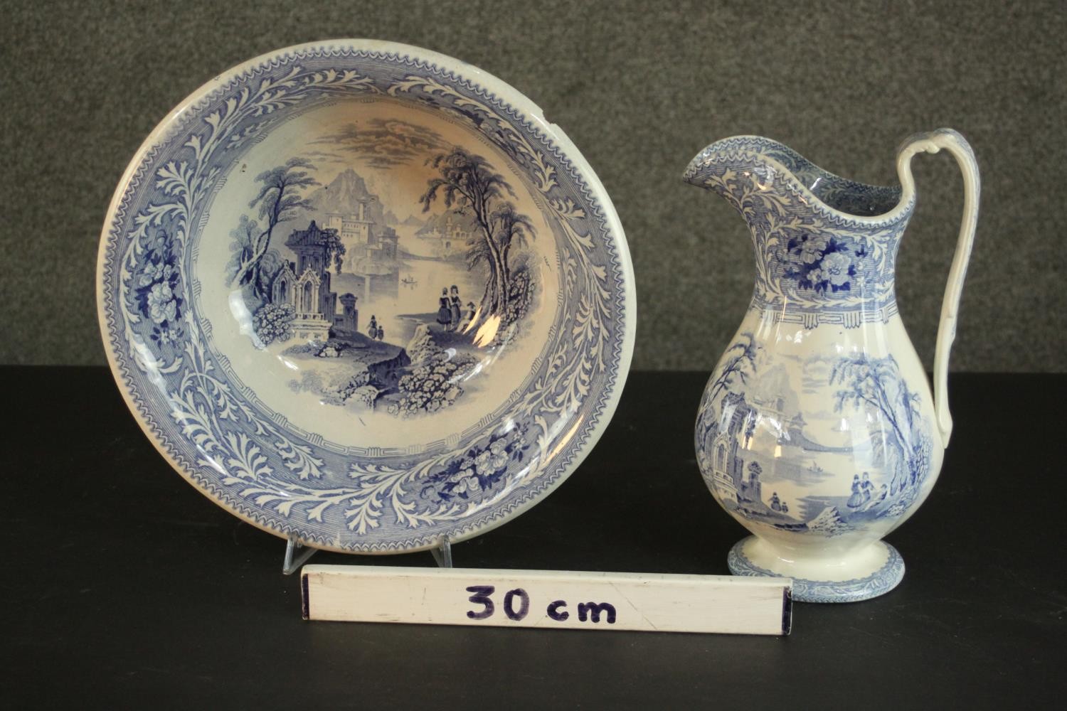 A Victorian Staffordshire blue and white china wash jug and basin, transfer printed with fantastical - Image 2 of 8