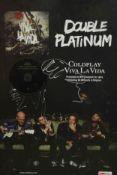 A framed and glazed signed Coldplay double platinum album, Viva la Vida. H.70 W.50cm.