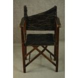 A 20th century 'Firma' folding campaign chair, upholstered in black fabric (damaged), made at the